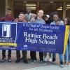 Students at Rainier Beach HS holding a recognition banner 