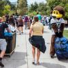 Chip the buffalo and campus community members volunteer during move-in