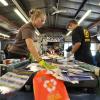 Students work at Recycling Center during campus sustainability tour