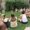Students sitting outdoors in a circle