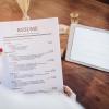 Person holding printed resume