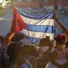 People hold up Cuban flag in Havana 2020