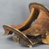 Photo of an ancient saddle made of wood