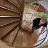 JILA graduate student and teaching assistant Cameron Straatsma climbs the spiral staircase in the JILA building. Photo by Casey A. Cass.