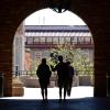 Students walking through UMC arch