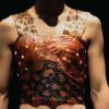 Person wears a shirt made out of kombucha leather with glowing LED lights