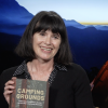 Phoebe Young holding her new book Camping Grounds 