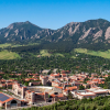 A scenic aerial shot of the CU Boulder campus and Flatirons