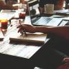 Group working together at table with papers and drinks
