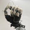 A prosthetic hand with fingertip sensors installed.