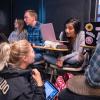 Classmates engage in discussion