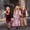 Children perform Shakespeare in costume on stage