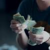 Person counting dollar bills