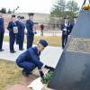 Air Force ROTC cadet leaves rose at shuttle memorial