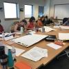 People work at a conference table.