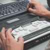 A person uses a braille screen reader. (Photo by Sigmund on Unsplash)