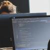 People coding at a computer
