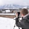 Kevin Ziznewski, a sophomore film and geography double major, snaps some frames of the snow-covered Flatirons. Photo by Patrick Campbell.