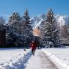 Student walking on snowy campus