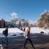 students walking on a snowy campus