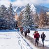Snowy scenic shot on CU boulder campus with students walking outside