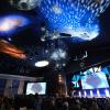 Light projections in an auditorium at the annual Space Symposium