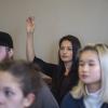 Student raising hand in Spanish class