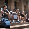 Students sit outside