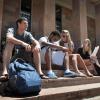 Students sitting on the steps of Norlin Library
