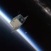 Artist's depiction of the SPRITE CubeSat orbiting Earth.