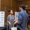 Student speaks with an employer at a startup fair 