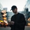 Stock image of a man looking at a phone