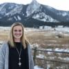Integrated physiology major Kelsey Sheehan poses in front of Flatirons