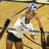 Sterling Parker hits volleyball over net
