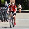 Student biking on campus