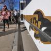 Students exit a Buff Bus