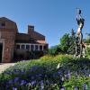 Statue, indigo flowers outside the UMC