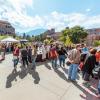 Campus community members visiting booths at the Take Care Street Fair