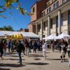Campus community members attend the Take Care Street Fair