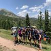 Students pose for photo in the mountains