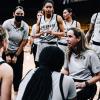 The CU women's basketball team in a huddle.