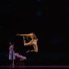 Dancers and actors perform on stage