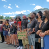 Black Lives Matter advocates with signs and megaphone on campus