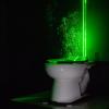 A powerful green laser helps visualize the aerosol plumes from a toilet when it’s being flushed.