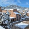 Snowy University Memorial Center with flatirons in background