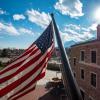 American flag flying at the UMC building