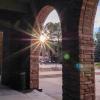 The sun sets, casting rays over the UMC loggia space. 