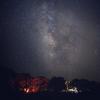 First place photo contest winner by Hongtian Zhu depicts a fire under a starry night sky