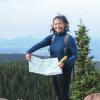 UROP award winner poses for photo with map 
