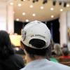 Man wearing "All American" armed forces hat